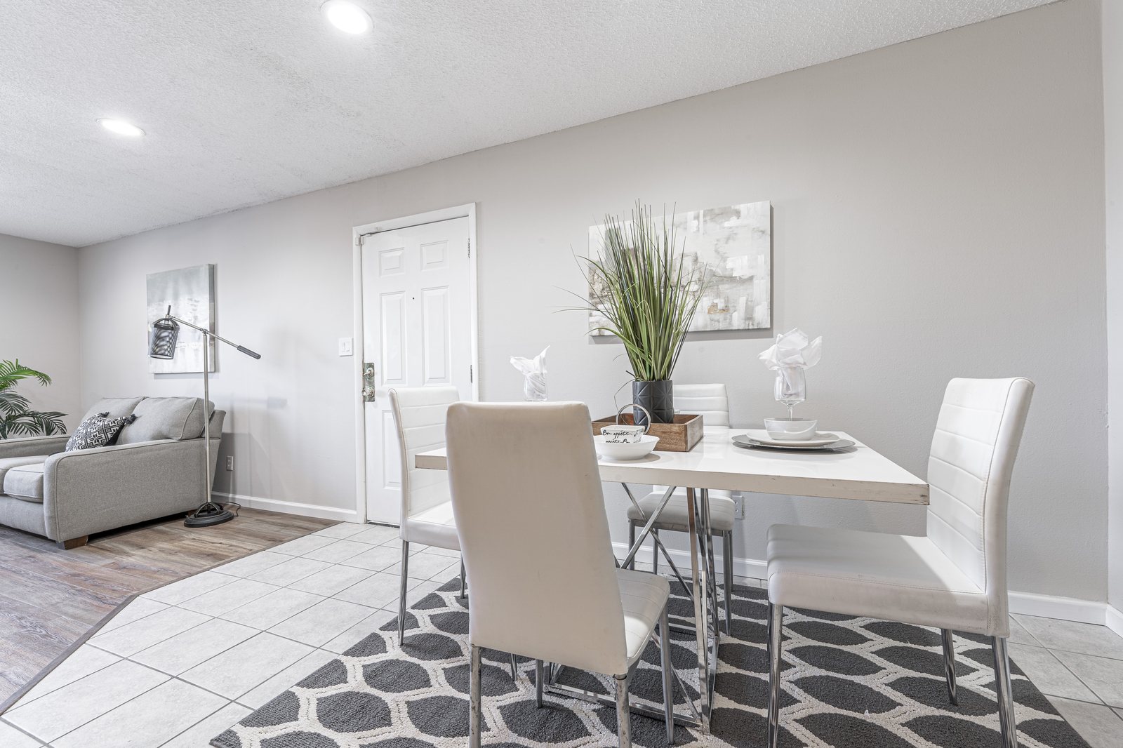 Renovated apartment dining and living space at Quail Creek